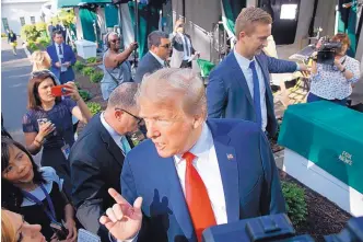  ?? EVAN VUCCI/ASSOCIATED PRESS ?? President Donald Trump speaks to reporters on the North Lawn of the White House Friday.