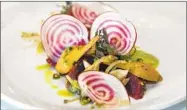  ??  ?? The beet salad is made with pistachio pastata, sorrel and buttermilk.