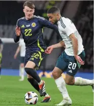  ?? ?? Conor Bradley drives at Scotland duo Liam Cooper and Jack Hendry, while (right) Brodie Spencer takes on Nathan Patterson