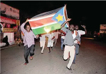  ?? — AFP ?? Residents of Juba in South Sudan celebrate in the streets the birth of their new nation on July 9, 2011.
