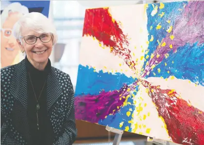  ?? TROY FLEECE ?? Longtime family physician and advocate for women’s health and early childhood education Dr. Sally Mahood stands beside a painting done in her name at the opening of the YWCA Regina Centre for Play and Developmen­t in Regina, which is being called Sally’s Place to honour her and Sally Elliott, a registered nurse who has been delivering perinatal programs through the Regina YMCA since 1991.