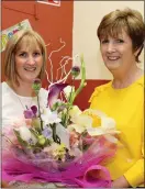  ??  ?? Mairead Fleming presented a bouquet of fresh flowers to Nuala Riordan.