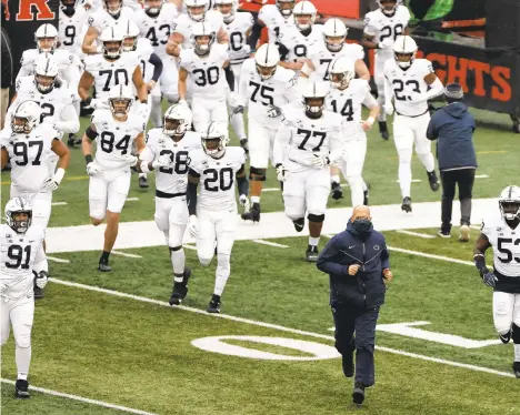  ?? ADAM HUNGER/WWAP ?? Penn State head coach James Franklin leads his team on to the field to face Rutgers on Dec. 5 in Piscataway, N.J.