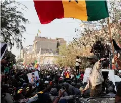  ?? REUTERS/Zohra Bensemra ?? Senegalese opposition leader Ousmane Sonko greets his supporters as he attends the protest to demand the release of alleged political prisoners ahead of his court appearance on Thursday on libel charges, in Dakar, Senegal March 14, 2023.