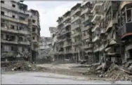  ?? THE ASSOCIATED PRESS ?? Damaged buildings are shown in the Sukkari neighborho­od of east Aleppo, Syria, on Friday.