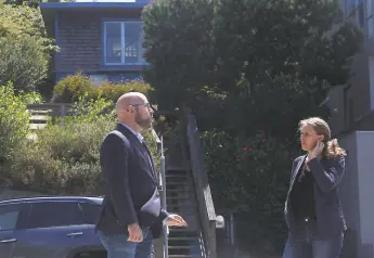  ?? Lea Suzuki / The Chronicle ?? S.F. Supervisor Rafael Mandelman (left) and historian Shayne Watson talk in front of the former home of the late Phyllis Lyon and Del Martin.