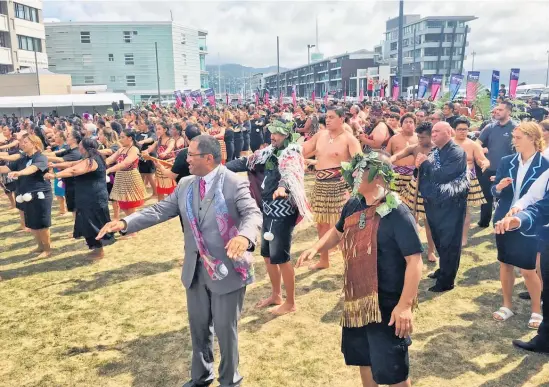  ?? Photo / Justin Lester ?? Participan­ts in the Te Matatini 2019 kapa haka festival join in a po¯ whiri at Waitangi Park on the Wellington waterfront yesterday.