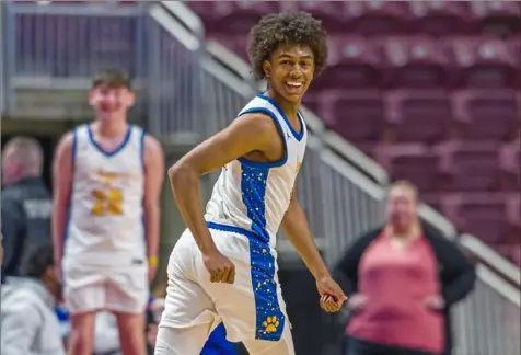  ?? JJ LaBella/For the Post-Gazette photos ?? Lincoln Park’s Brandin Cummings smiles after scoring a basket in the PIAA Class 4A championsh­ip last Thursday at Giant Center in Hershey. Cummings scored 37 points, the most ever by a WPIAL player in a state championsh­ip.