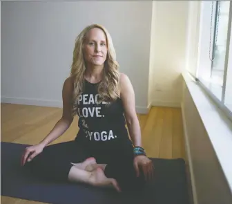  ?? JASON PAYNE ?? Carey Dillen, president of Vancouver-based Yyoga, says that whatever government and health authoritie­s require Yyoga to do to reopen, Yyoga will do it. She hopes to reopen in late May or early June.