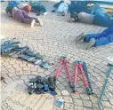  ?? Picture: SAPS ?? Seized weapons and some of the 40 men who were arrested for the attack the Internatio­nal Pentecosta­l Holiness Church.