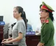  ?? — AFP ?? Vietnamese blogger Nguyen Ngoc Nhu Quynh stands trial at a courthouse in the central city of Nha Trang.