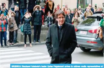  ??  ?? BRUSSELS: Dismissed Catalonia’s leader Carles Puigdemont arrives to address media representa­tives at The Press Club in Brussels yesterday.