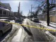  ?? MARC LEVY — THE ASSOCIATED PRESS ?? Crime tape stretches across a road near the scene of a shooting Thursday in Harrisburg, Pa. The mayor of Harrisburg said a U.S. marshal is dead after being shot while serving an arrest warrant in the city. Mayor Eric Papenfuse said two other officers...