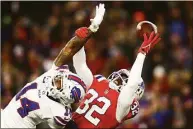  ?? Adam Glanzman / Getty Images ?? Patriots safety Devin McCourty breaks up a pass intended for Bills wide receiver Stefon Diggs in the second quarter at Gillette Stadium on Thursday in Foxborough, Mass.