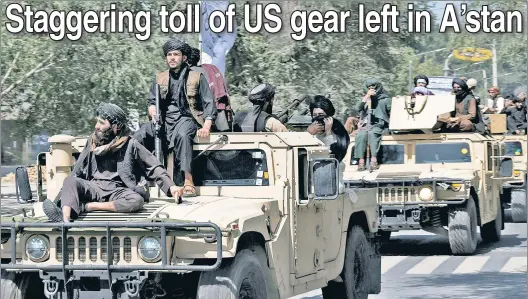  ?? AFP via Getty Images ?? THANKS FOR THE RIDES: Taliban fighters parade atop Humvees last August on the 1-year anniversar­y of the United States’ chaotic withdrawal.