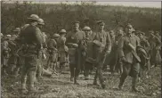  ?? U.S. ARMY HERITAGE AND EDUCATION CENTER ?? This photo provided by U.S. Army Heritage and Education Center has been cropped in to show a closer view of American soldiers with German prisoners in northern France during World War I on Sept. 26, 1918.