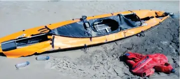  ??  ?? Abandoned: Police photo of her kayak and the lifejacket she had been wearing