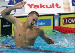  ?? Associated Press ?? Big splash: United States' Caeleb Remel Dressel celebrates after winning the gold medal in the men's 100-meter butterfly final during the swimming competitio­ns of the World Aquatics Championsh­ips in Budapest, Hungary, Saturday.