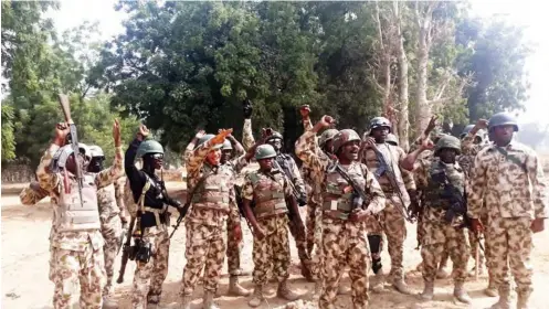  ?? PHOTOS: ?? Troops at cross Kauwa in Kukawa LGA of Borno during Christmas celebratio­n Olatunji Omirin