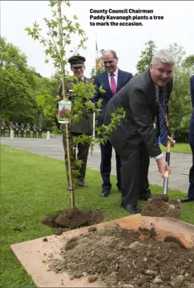  ??  ?? County Council Chairman Paddy Kavanagh plants a tree to mark the occasion.