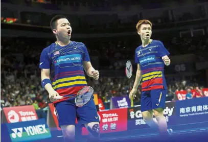  ??  ?? Poor show: Malaysia’s Aaron Chia (left) and Soh Wooi Yik fell to Taiwan’s Lu Ching-yao-Yang Po-han in the SS Purple League match yesterday.
