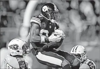  ?? [KEITH SRAKOCIC/THE ASSOCIATED PRESS] ?? Steelers receiver Antonio Brown beats Titans cornerback LeShaun Sims, left, for a touchdown catch during Thursday night’s game in Pittsburgh.