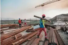  ?? AFP ?? Workers at the Grand Ethiopian Renaissanc­e Dam in Ethiopia last year.