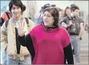  ??  ?? “I NEEDED TO show that reality,” says the director Gurinder Chadha, on set with actor Viveik Kalra.