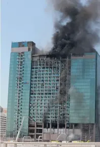  ?? Photo By Ryan Lim ?? Investigat­ion is on to determine the cause of the blaze happened at the building near the Abu Dhabi Mall —