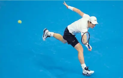  ?? Photograph: Getty ?? Andy Murray returns a shot against David Ferrer in their China Open semi-final