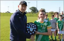  ??  ?? Hugh Kenny presents Joshua Farrell with the trophy.