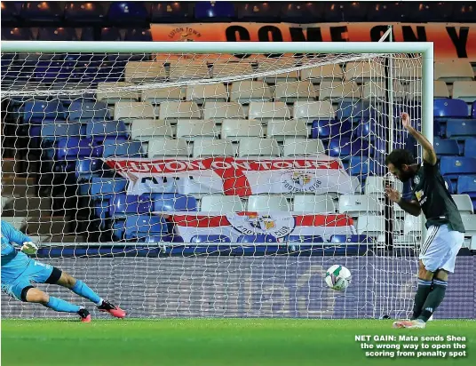  ??  ?? NET GAIN: Mata sends Shea the wrong way to open the scoring from penalty spot