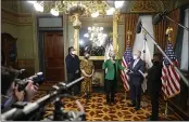  ?? ANDREW HARNIK — THE ASSOCIATED PRESS FILE ?? Jennifer Granholm is sworn in as Energy Secretary by Vice President Kamala Harris, as her husband, Dan Mulhern, holds the Bible in the Eisenhower Executive Office Building in the White House complex in Washington.