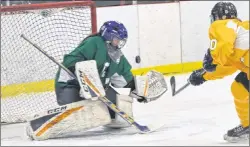  ?? JASON SIMMONDS/JOURNAL PIONEER ?? Taylor Gillis of the Three Oaks Axewomen beats KISHORA goaltender Hannah LeClair with this second-period shot to open the scoring in the girls’ championsh­ip game of the 2018 Kensington Intermedia­te-Senior High School invitation­al friendship high school...