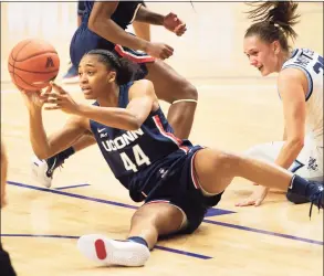  ?? Laurence Kesterson / Associated Press ?? UConn’s Aubrey Griffin (44) gets the ball away from Villanova’s Sarah Mortensen on Tuesday.