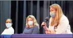  ?? Jeremy stewart ?? Redmond Regional internal medicine physician Dr. Megan White (right) talks while sitting next to nurse practition­er Jina Ford (center) and internal medicine physician Dr. Tessa Gibson (left) during a COVID-19 vaccine town hall in Rockmart on Tuesday, Sept. 21.