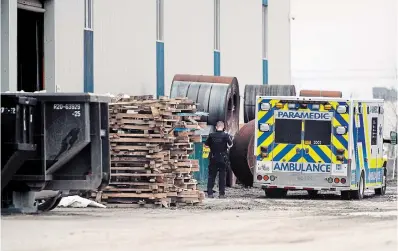  ?? JOHN RENNISON THE HAMILTON SPECTATOR ?? A police officer photograph­s the scene at Janco Steel Ltd. in Stoney Creek where a worker was killed on Tuesday.