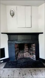  ?? SARAH COLE VIA AP ?? This 2017 photo provided by Sarah Cole shows the central fireplace in the kitchen of the James Blake House in Boston, which dates back to 1661. Cole is restoring the home’s interior to make it more livable for current caretaker Barbara Kurze.