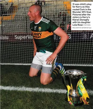  ?? STEPHEN MCCARTHY/SPORTSFILE ?? It was child’s play for Kerry as they routed Cork in the Munster SFC final. Pictured after the victory is Kerry’s Kieran Donaghy with his daughter Lola Rose