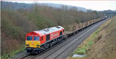  ??  ?? Vegetable oil-powered DB Cargo Class 66 66150 brings up the rear of the 6W98 St Erth to Westbury Down Yard working on December 21, 2020; leading is 66085. (Stuart Kirkby)