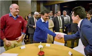  ??  ?? Chief minister Arvind Kejriwal shakes hand with Fukuoka Prefecture ( Japan) governor Hiroshi Ogawa in New Delhi on Tuesday as deputy CM Manish Sisodia looks on. Celebratin­g the 10th anniversar­y of a friendship agreement, national capital territory of...