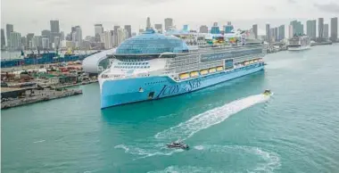  ?? PEDRO PORTAL/DORAL NUEVO HERALD ?? Royal Caribbean’s Icon of the Seas, the world’s largest cruise ship, heads to the dock Jan. 10 at PortMiami in Florida.