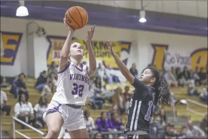  ?? Chris Torres/ The Signal ?? Valencia guard Cara Mckell (32) goes up for a layup against Saugus guard Evamarie Rios during Friday’s Foothill League matchup at Valencia High School.