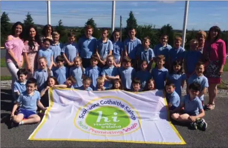  ??  ?? Raheen NS pupils celebrate achieving their Health Promoting School Flag.