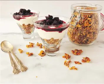  ?? RENEE KOHLMAN ?? Sour cherry, yogurt and granola parfaits are easy to prepare and look fancy.