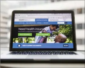  ?? ANDREW HARNIK — THE ASSOCIATED PRESS ?? they can drop out later. This Thursday photo shows the HealthCare.gov website, where people can buy health insurance, displayed on a laptop computer screen in Washington. Millions of Americans will still need to navigate the current federal health care...
