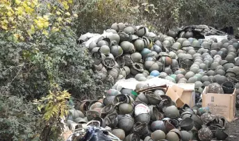  ?? — AFP photo ?? A pile of Armenian army helmets lie on the ground at the edge of the army’s facility outside Stepanaker­t, where a Russian peacekeepi­ng contingent deployed this week to set up checkpoint­s and positions.