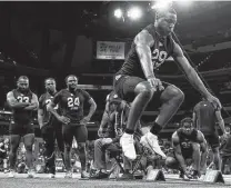  ?? Steve Luciano / Associated Press ?? A&M’s Isaiah Spiller, one of the top three RB prospects in the upcoming draft, does the broad jump at the combine Friday.