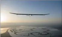  ??  ?? The Solar Impulse en route to Phoenix from California. Pilot Bertrand Piccard, right, said flying the solar-powered plane was like being in a dream.
PICTURE: REUTERS