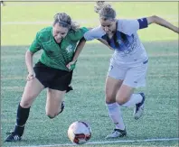  ??  ?? Charlottet­own’s Maddie Hurley, left, battles a Quebec player during the Canada Games soccer competitio­n Tuesday in Winnipeg. Quebec led 3-0 at the half en route to a 7-0 victory.